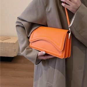 Orange shoulder handbag